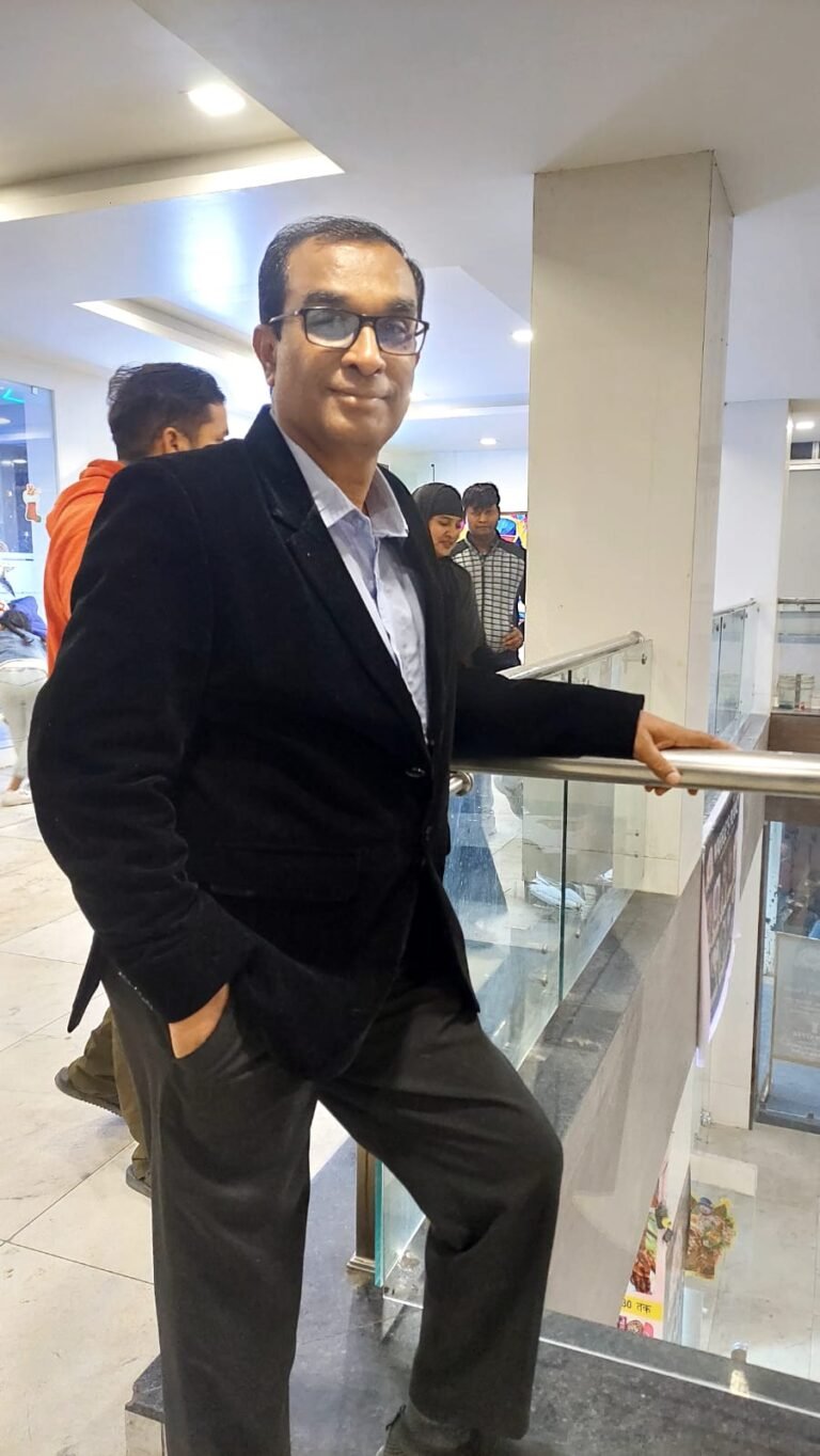 Dhafrani Sir, Super English Coach, smiling confidently in a formal shirt